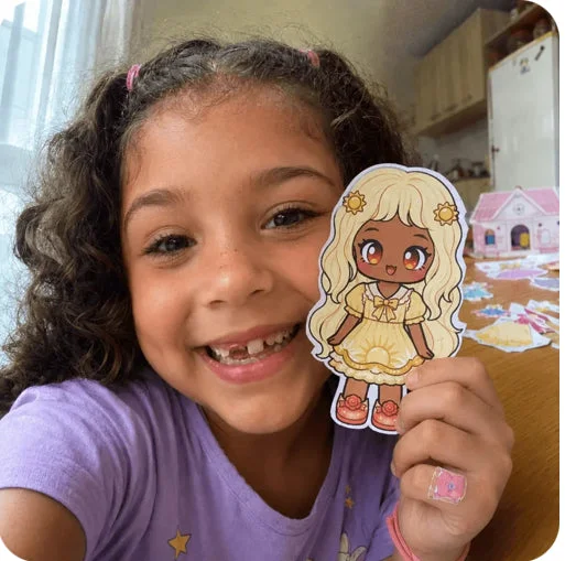 Girl playing with paper dolls