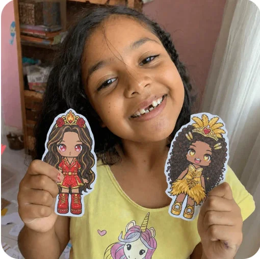 Girl playing with paper dolls